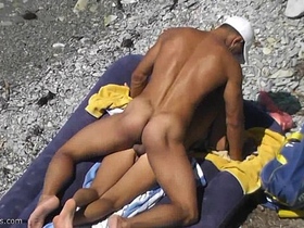 Peeking at naked babes on the beach