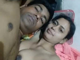 Indian wife and her husband enjoy a sensual breast play