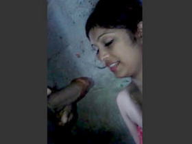 Indian girl talks while giving a hot blowjob to her lover in the bathroom