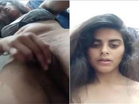 A stunning girl reveals her breasts and intimate area