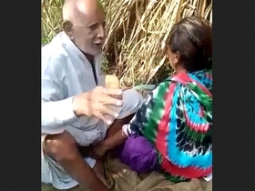 Elderly man Tau engages in sexual activity with Randi amidst the wilderness