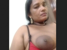 The wife showcases her large breasts