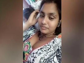 A South Asian woman reveals her cleavage during a chat
