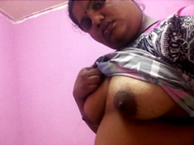 Mature Indian woman flaunts her breasts in front of her husband