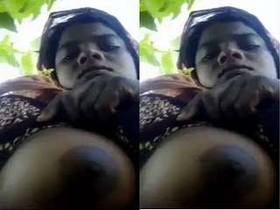 Watch a rural Indian woman flaunt her breasts in a steamy video