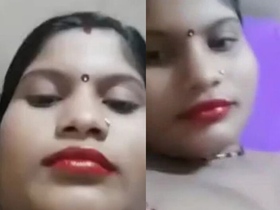 A charming Indian bhabi shows off her ample bosom