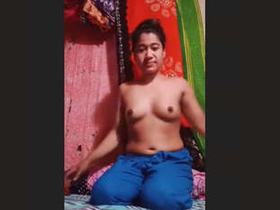 Watch a stunning bhabhi strip naked and show off her body