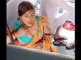 Indian train ride leads to a revealing display of a curvy village woman's bust