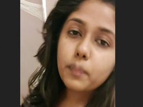 Solo woman proudly displaying her breasts