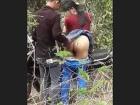 Couple enjoys sex in the woods near a park