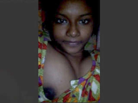 Cute Indian girl flaunts her big tits in a solo video
