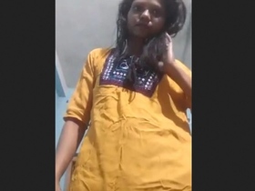 A woman of Indian descent seduces her partner with a performance