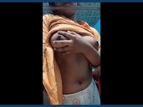 A lovely Indian girl displays her beautiful breasts