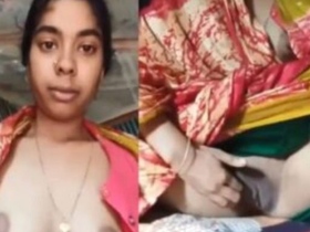 Married Indian woman sensually reveals her breasts and intimate area