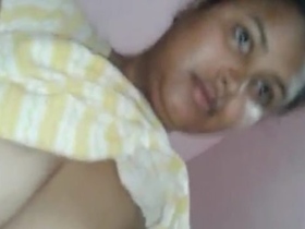 A seductive Indian housewife engages in explicit sexual activity