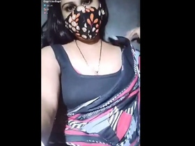 Bhabhi revealing her voluptuous breasts in an enticing way