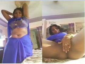 Watch a hot Tamil bhabhi tease and please with her pussy