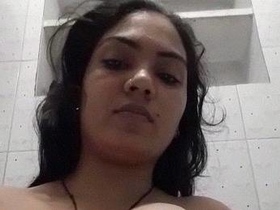 Indian bhabhi in the bathroom recording her nude body on camera