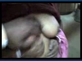 Indian auntie's breasts and vagina stimulated by lover