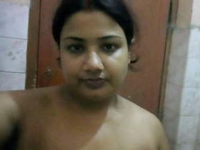 Adorable selfies of a busty aunt in the bathroom