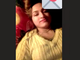 A stunning woman displays her breasts and genitals in a heated video chat