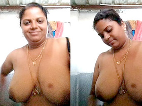 Aroused Indian aunt displays her large breasts
