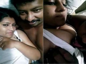 Tamil wife gives oral pleasure to husband's breasts