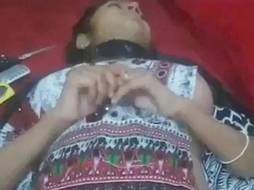 This hot video features a southern Indian woman showing off her intimate parts