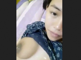 Aroused young woman with attractive breasts