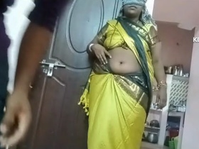 A Tamil wife indulges in erotic play with her navel, tastes honey, and engages in intimate relations