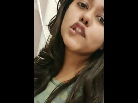 Anisa, a college student from Lucknow, indulges in playful activities in this recording