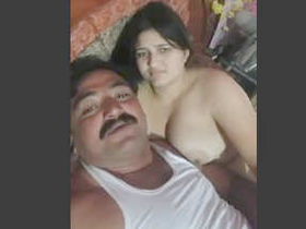 A cute Indian girl engages in intense sexual activity with her father's friend