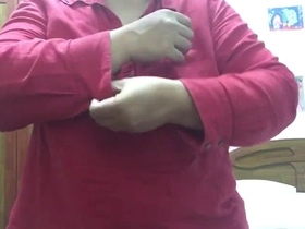 A mature woman undressing on camera