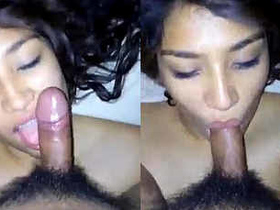 A pretty Asian girl performs oral sex