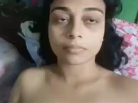 Aroused college woman pleasuring herself