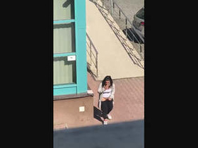 A black woman pleasuring herself outdoors