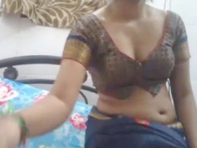 Indian beauty in saree performs on webcam