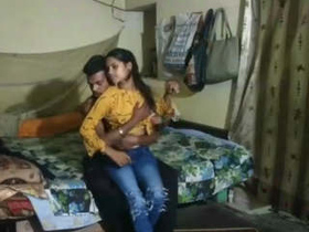 Aroused girlfriend and her youthful partner delve into their carnal cravings in an enclosed space