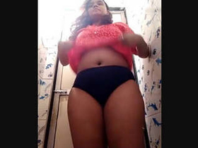 Chubby Indian woman indulges in risqué behavior in the restroom