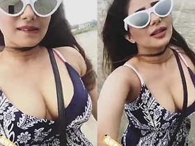 Curvy hottie flaunts big boobs on the beach