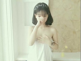 Asian beauty uses her stunning looks to captivate viewers in a steamy video