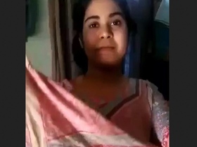 A stunning pie undresses and tempts her partner in a striped outfit