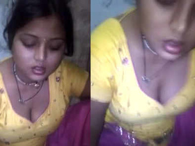 Cute girl eats chapathi, showing off her cleavage