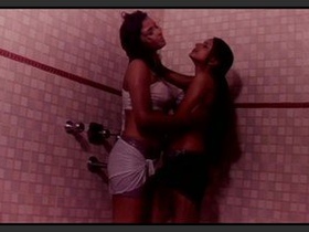 Lesbians indulge in passionate encounter with water