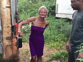 Outdoor interracial action featuring an older woman