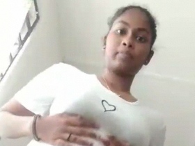 Tamil girl strips and pleasures herself with her hairy pussy