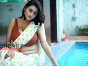 Indian girl with large breasts poses for photos