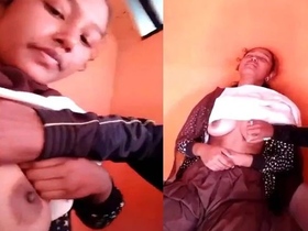 A village woman with large breasts satisfies her partner in India