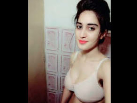 Pakistani college girl with large breasts indulges in provocative behavior on film