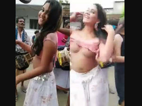 Naked prostitutes dance in public place, attracting attention of people